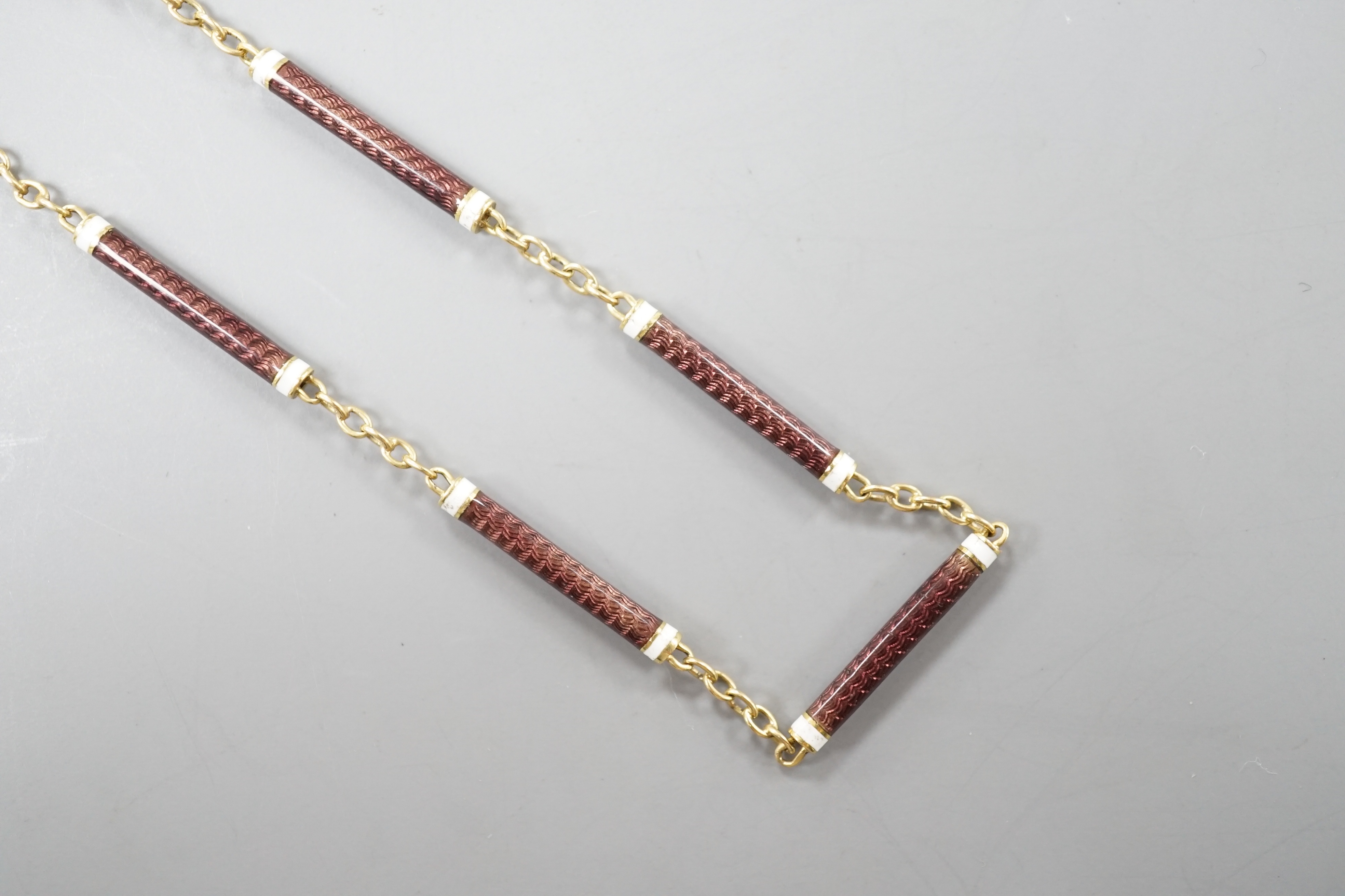 A 9ct and two colour enamelled baton link necklace, 52cm, gross 7.1 grams.